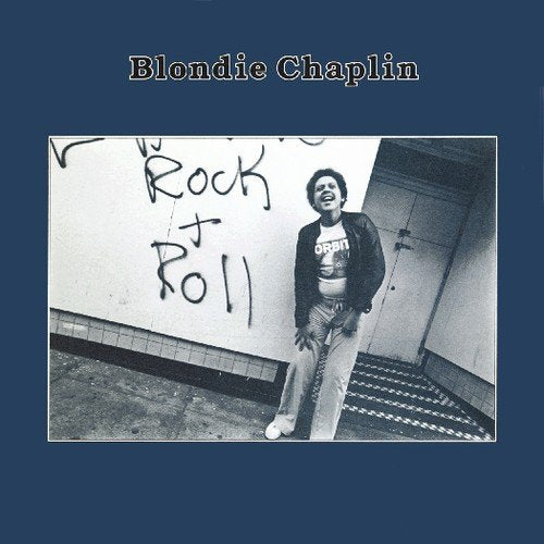 Blondie Chaplin album cover: man posing in front of graffiti wall.