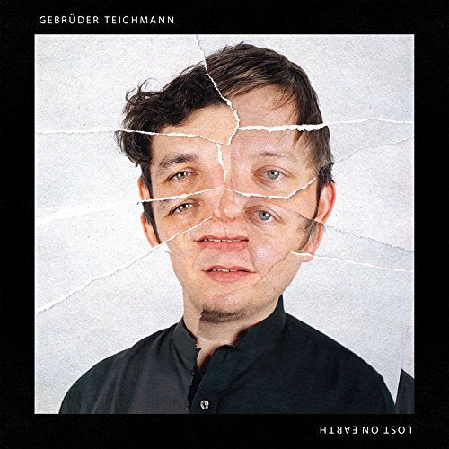 "Album cover with a man's face broken into pieces on cracked white background."