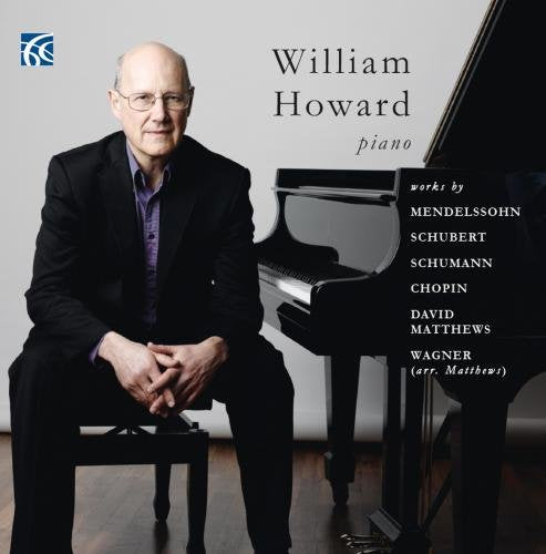 "Man in a black suit sitting beside a grand piano on a CD cover."