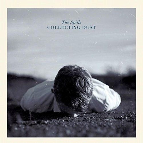 Black and white vinyl album cover with a man lying face down on the ground.
