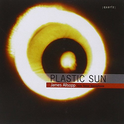 "Album cover with a glowing ring around a black center, titled 'Plastic Sun'."