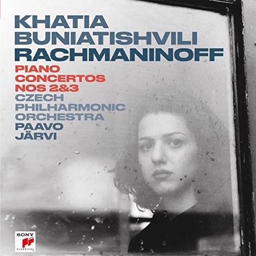 Vinyl record sleeve with a black and white photo of a woman and visible vinyl.