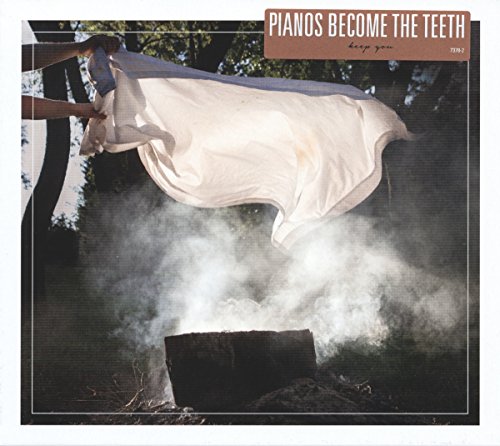 Album cover with a person burning a sheet outdoors, surrounded by smoke.
