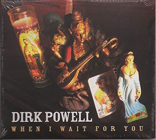 "Album cover with figurines, candle, and card on a dark background."