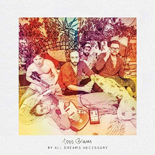 Album cover with four men lounging on a bed, surrounded by foliage and musical instruments.