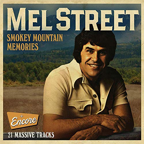 "CD cover featuring a smiling man with mountains in the background."