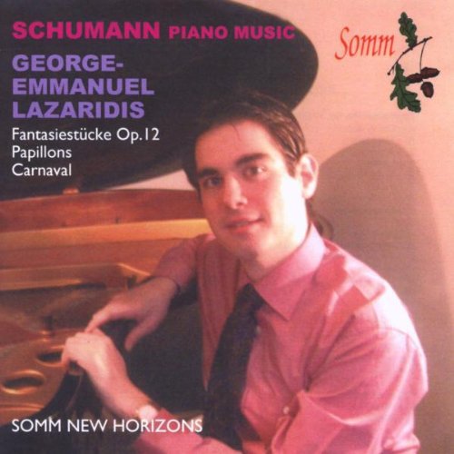 Man sitting at piano, wearing pink shirt, on a CD cover with text.