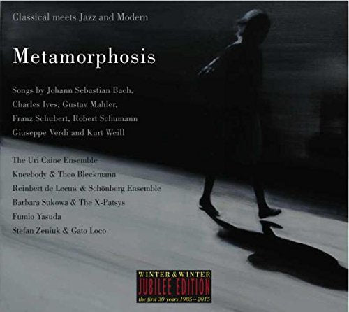 "CD cover with a woman in a dress, shadow on the ground, and artist names."