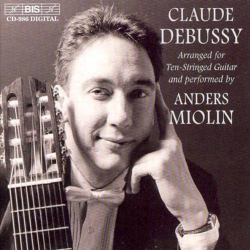 "Black and white CD cover with man holding guitar, wearing bow tie."