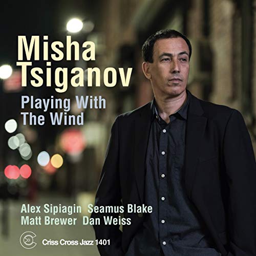 "Misha Tsiganov CD cover featuring a man in a dark suit jacket."