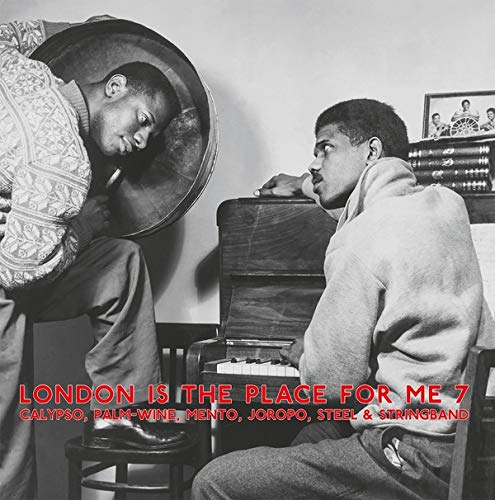 Black and white vinyl album cover with two men and red text overlay.