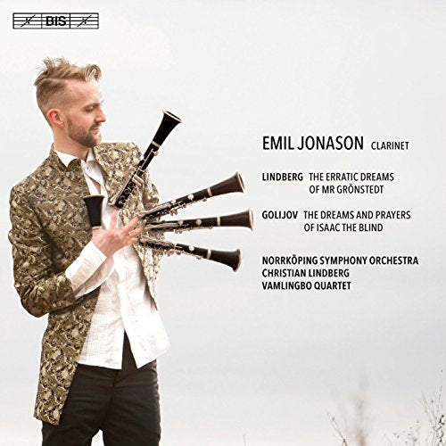 Man holding multiple clarinets, wearing a patterned jacket, on a music CD cover.