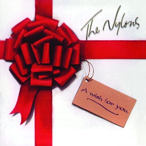 "Album cover with red ribbon and gift tag, 'The Nylons' in cursive."