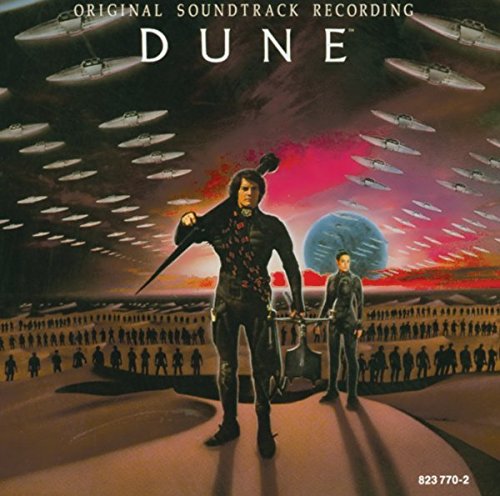 "Dune soundtrack cover art showing two men in black attire amidst futuristic aircraft."