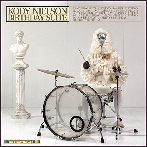 "Kody Nielson's 'Birthday Suite' vinyl cover featuring a person in white playing drums."