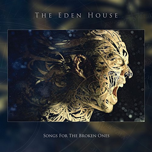 "CD album cover with a gold, intricately designed screaming head against a dark background."