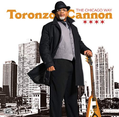 "Album cover featuring a man in a hat holding a guitar, cityscape behind."