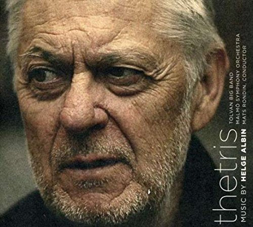 CD cover featuring a close-up of an older man's face with white hair.