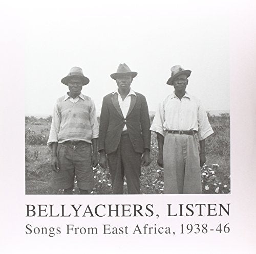 "Black and white vinyl album cover featuring three men standing in a field."