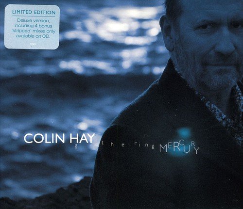"Colin Hay album cover with a man standing by water, Amazon logo overlay."