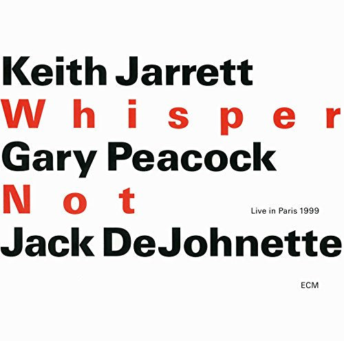 "Album cover with white background, black and red text, featuring artist names and title."