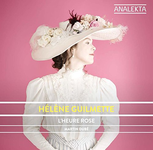 Woman in white dress and floral hat against a pink background with text overlay.
