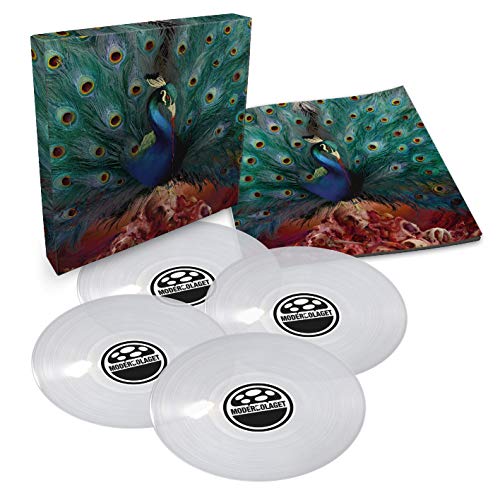 "Clear vinyl records with 'Sorceress' label, peacock album cover art on box and sleeve."