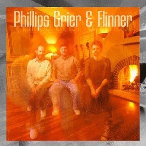 "CD cover featuring three men sitting together in a warm, lit room."