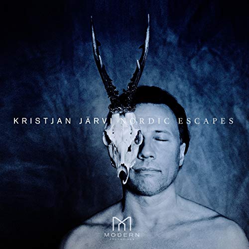 "CD cover with a man wearing a skull mask and antlers, dark background."