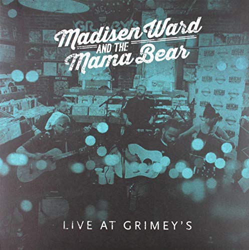 Blue-tinted vinyl album cover featuring a band performing on stage with instruments.