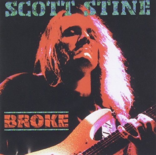 Album cover featuring a man with long hair playing an electric guitar.