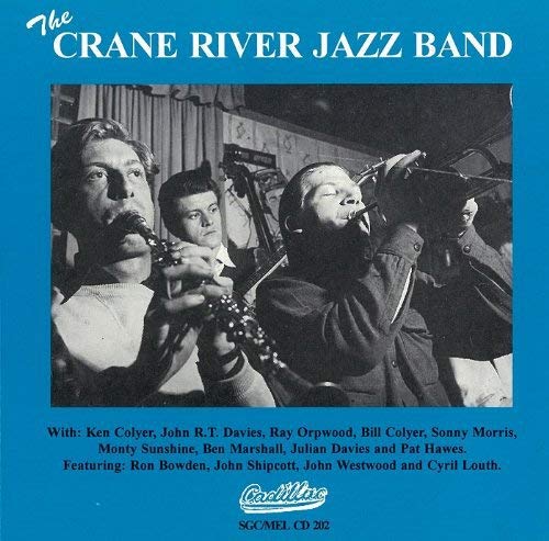 "Blue album cover with black and white photo of four jazz musicians playing instruments."