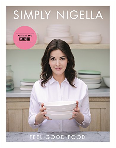 "Book cover featuring Nigella Lawson holding white bowls, with kitchen background and text."