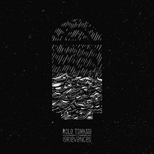 "Black album cover with abstract white design and text 'Rolo Tomassi Grievances'."