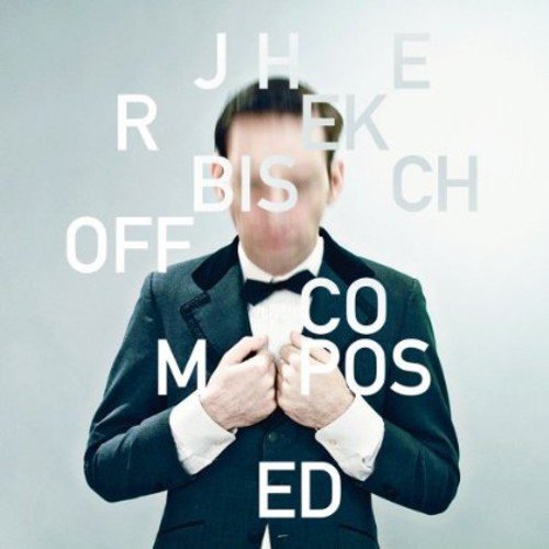 Man in tuxedo with obscured face, surrounded by white text on gray background.