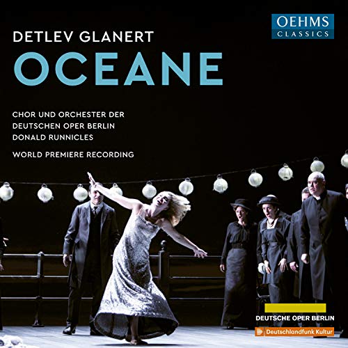 "CD cover featuring a dramatic opera scene with a woman and men on stage."
