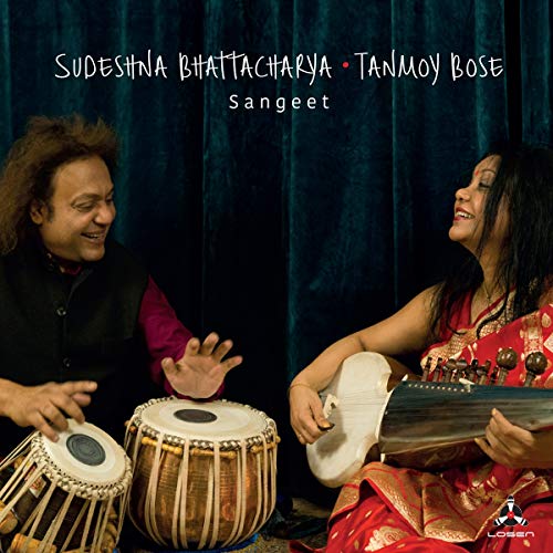 "Album cover featuring a man and woman playing traditional Indian instruments together."