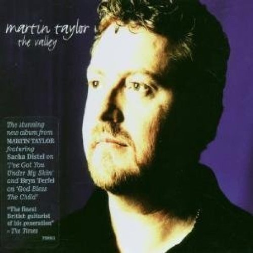 Album cover featuring a man with short hair and a dark shirt against a purple background.