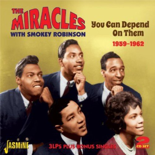 "CD cover featuring The Miracles, a group of men in suits, against a yellow background."