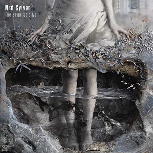 A haunting album cover featuring a woman in a white dress emerging from a sinkhole.