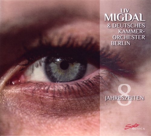 CD cover with a close-up of a blue eye and white and red text.