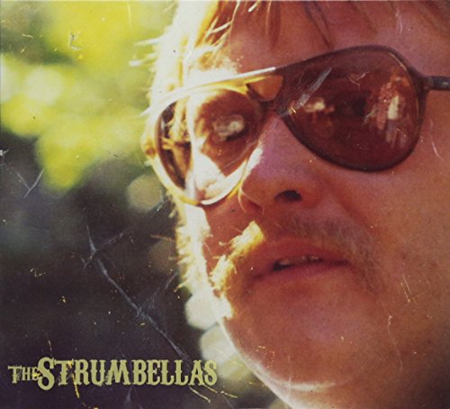 The alt text for the image is: "CD cover with a man's face wearing sunglasses."