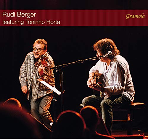CD cover with two musicians performing on stage, playing stringed instruments and singing.