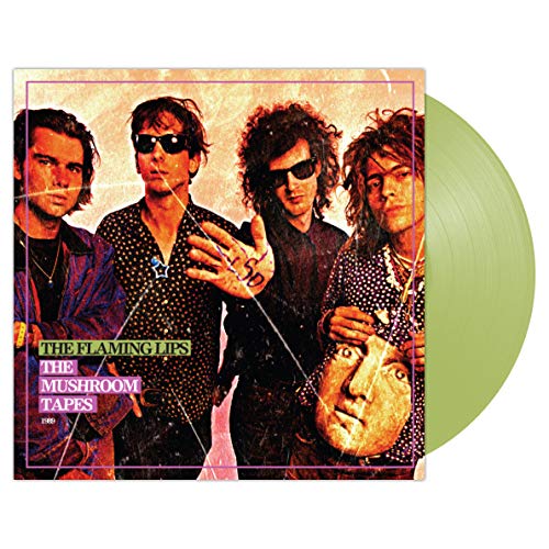 The image shows the vinyl album cover for "The Flaming Lips - The Mushroom Tapes". Alt text: Four men on a vinyl album cover with abstract, distorted effects.