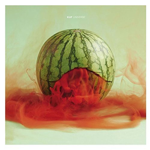 A watermelon is shown with a cut-out section, surrounded by red mist.
