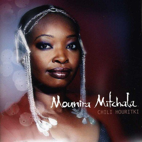 "CD cover featuring a woman wearing a beaded headpiece and the artist's name."