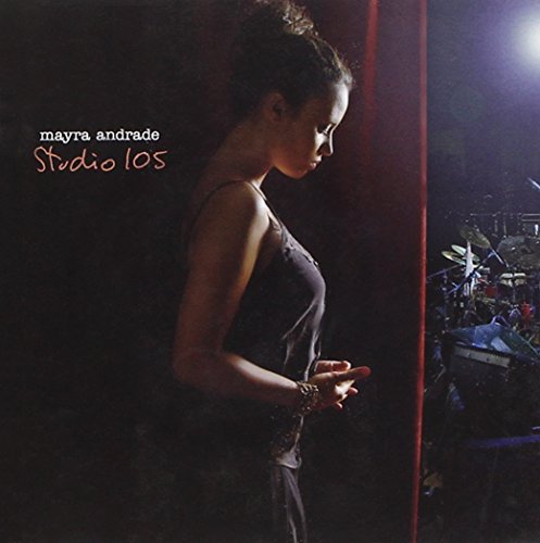 "CD cover with a woman standing in a dimly lit stage setting."
