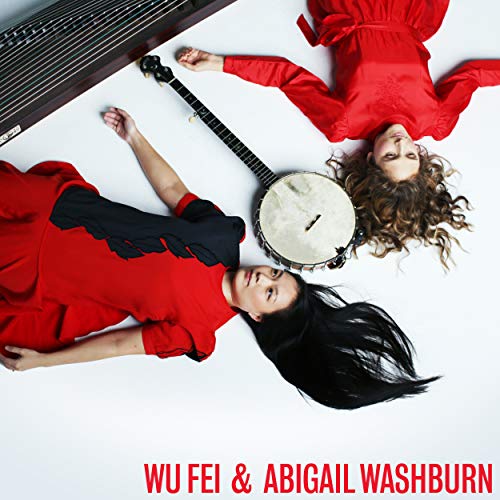 Album cover featuring two women in red lying on a white background with musical instruments.
