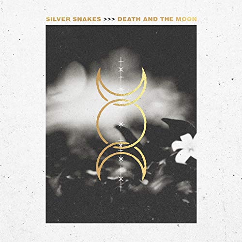"Album cover with a black-and-white photo and gold crescent moon symbols."
