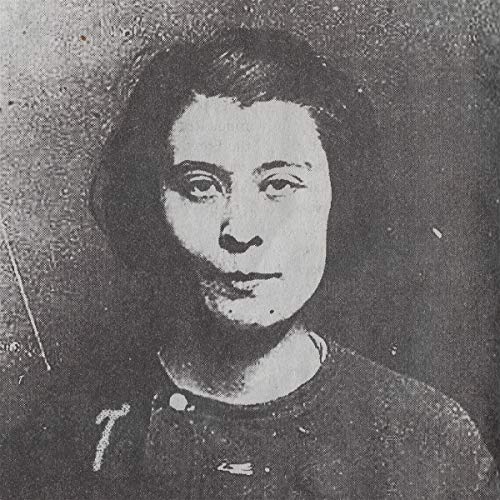 Black and white portrait of a person with short dark hair.